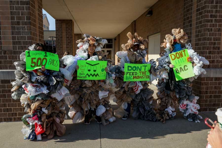 As students walked into school they were greeted by a group of plastic bag monsters.