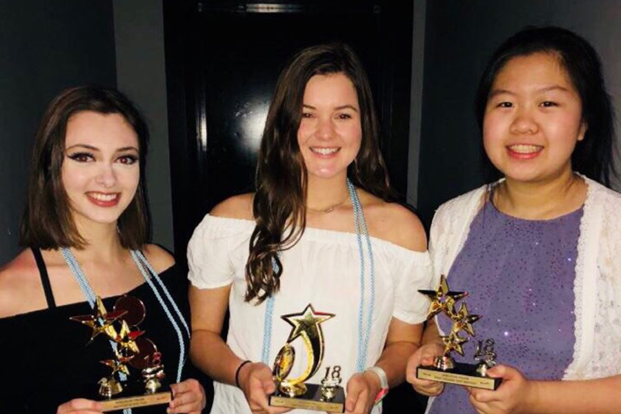 This years Editors, senior Brooke Colombo, senior Keegan Williams, and junior Megan Lin pose for a picture together with their awards from the Wingspan banquet.
