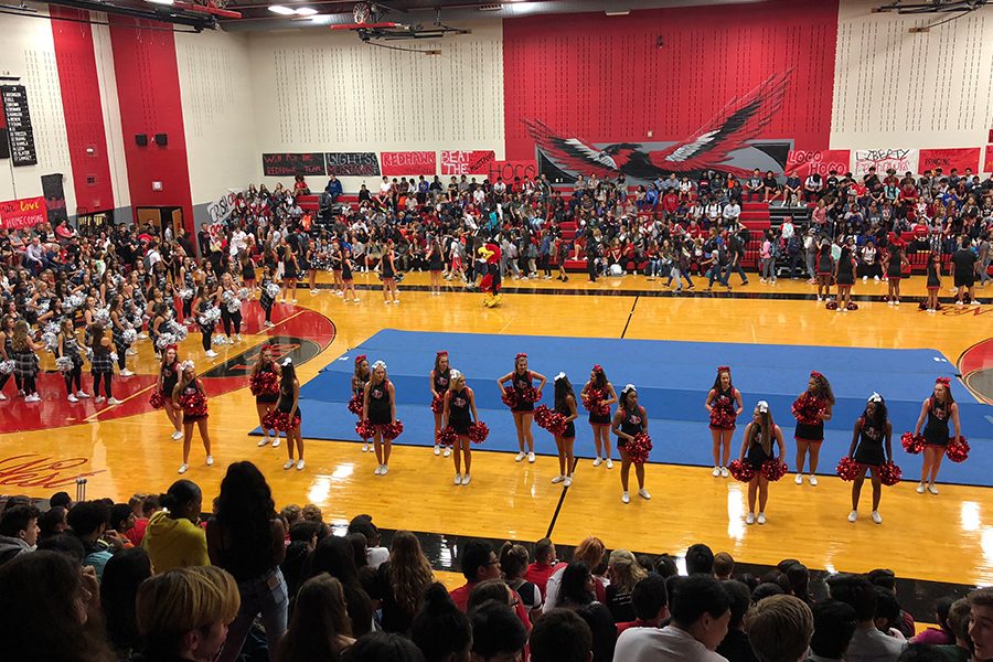 Cheerleaders take the floor at the start of Fridays homecoming pep rally. The indoor event was safe from the weather, but Fridays forecast could lead to a change in routine at the football game against Carrollton Creekview. 