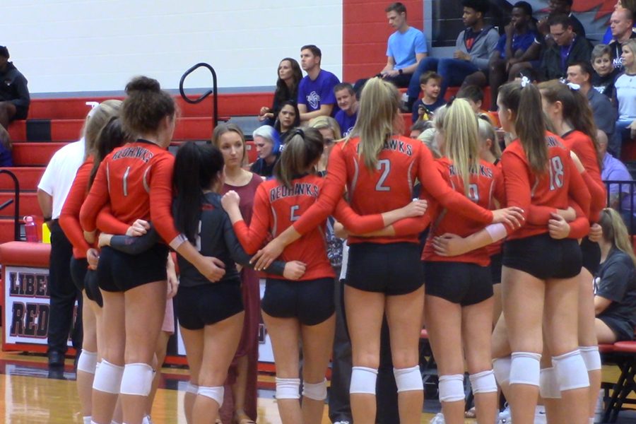 The volleyball team circles up during its Friday match against Independence. The team swept the Knights 3-0 for its 6th straight win to remain in a tie for first place. 