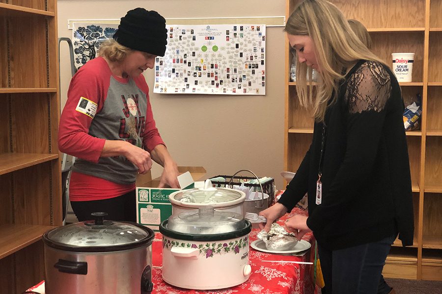 Math teacher Kelli Duckworth attends the cookie exchange and lunch held in the library. Besides many deserts that were offered, the teachers were also offered food. This annual event is a way to show appreciation to the teachers.