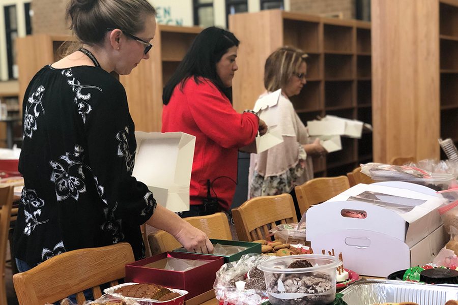 Many teachers filled to go boxes with baked goods. The goods were provided by students and parents.