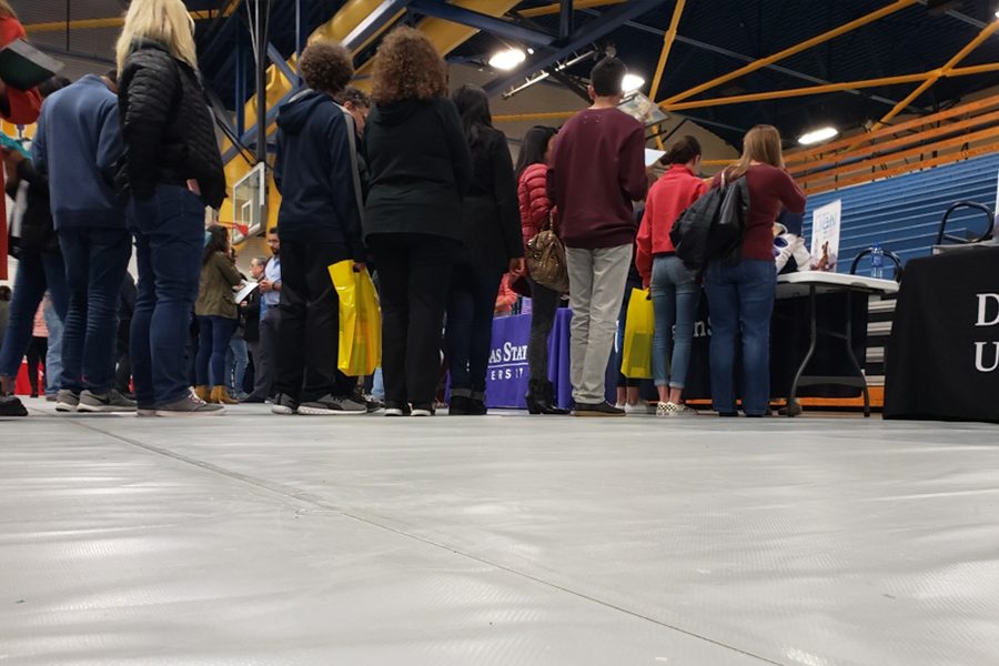 During the FISD College Fair, students and parents wait in line for the University of Penn State along with multiple other attendees. The FISD students and parents plan to get a more indepth look at what the University of Penn State has to offer.
