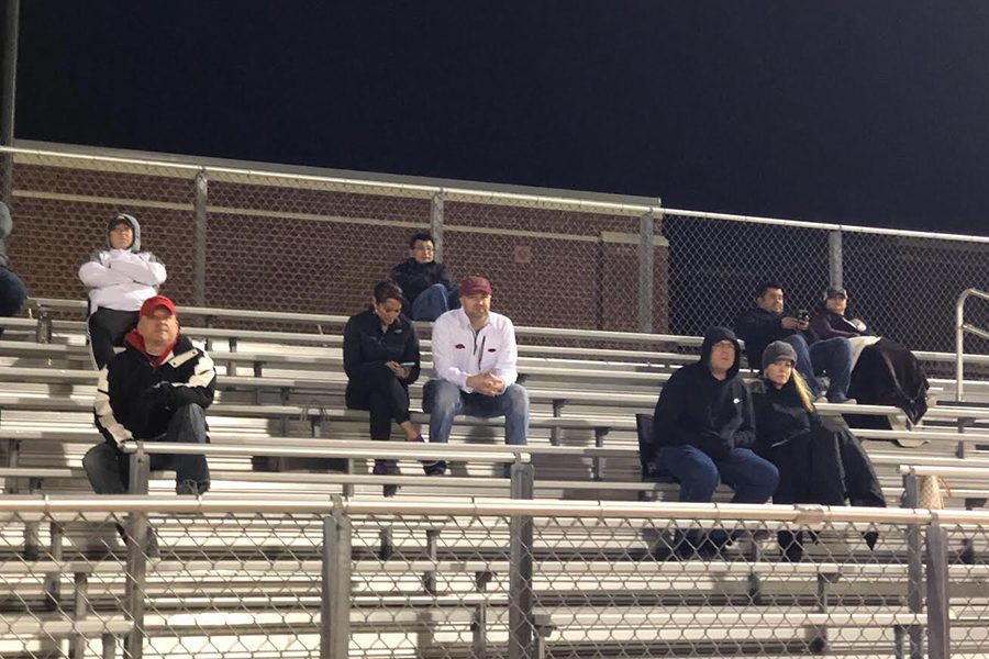 Watching boys soccer go against the Reedy Lions, parents and fans sit in the stands as they cheer on the Redhawks on Friday, Jan. 18.
