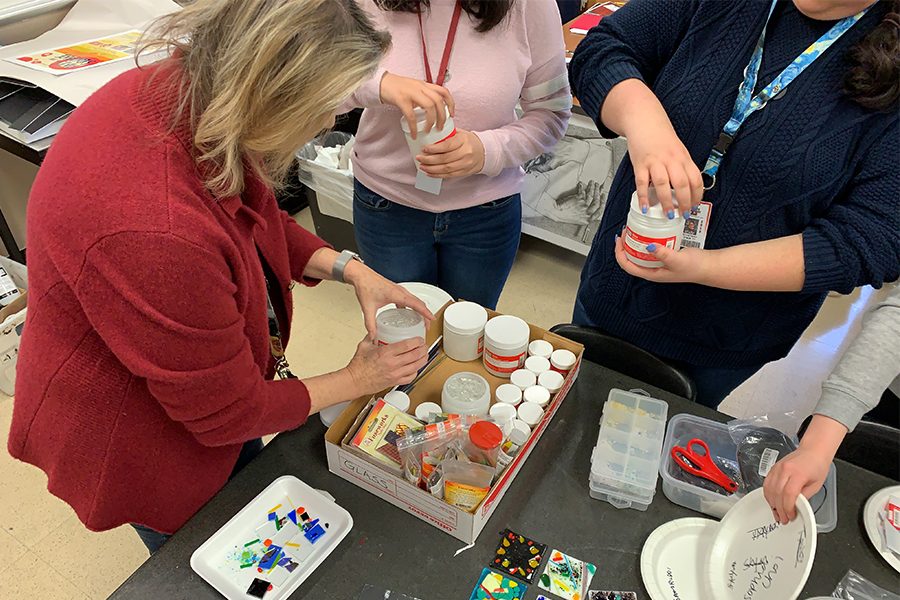 Taking the lid off some supplies, art teacher Pernie Fallon was inspired to start the project after attending a professional development session. 