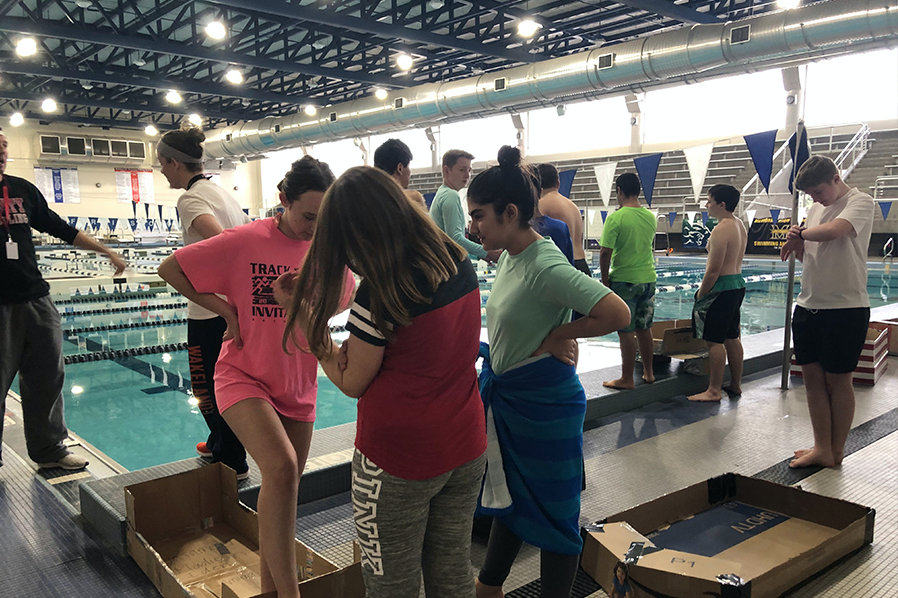 Students getting ready to begin their major grade project of testing out their homemade cardboard boats they created for the new unit of boater education.
