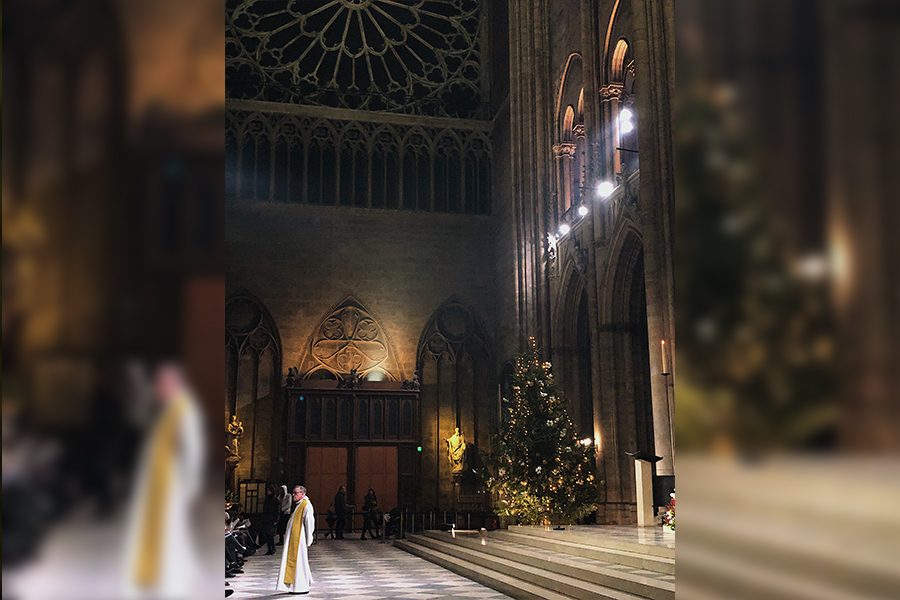 A priest beginning the Christmas Eve service at Notre Dame is one of the highlights to see when in France, a country where there are many food options for people with different diets. 
