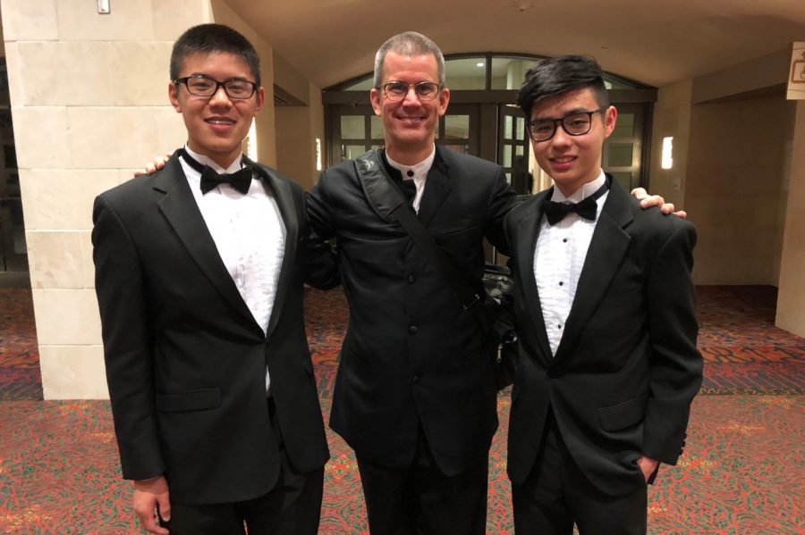 Seniors Richard Huang and Daniel Yang pose with the All-State Symphony Orchestra Director,Kevin Noe. Both Huang and Yang, along with senior Josh Lee and freshman Jeamin Yun, got first chair in their respective categories. 