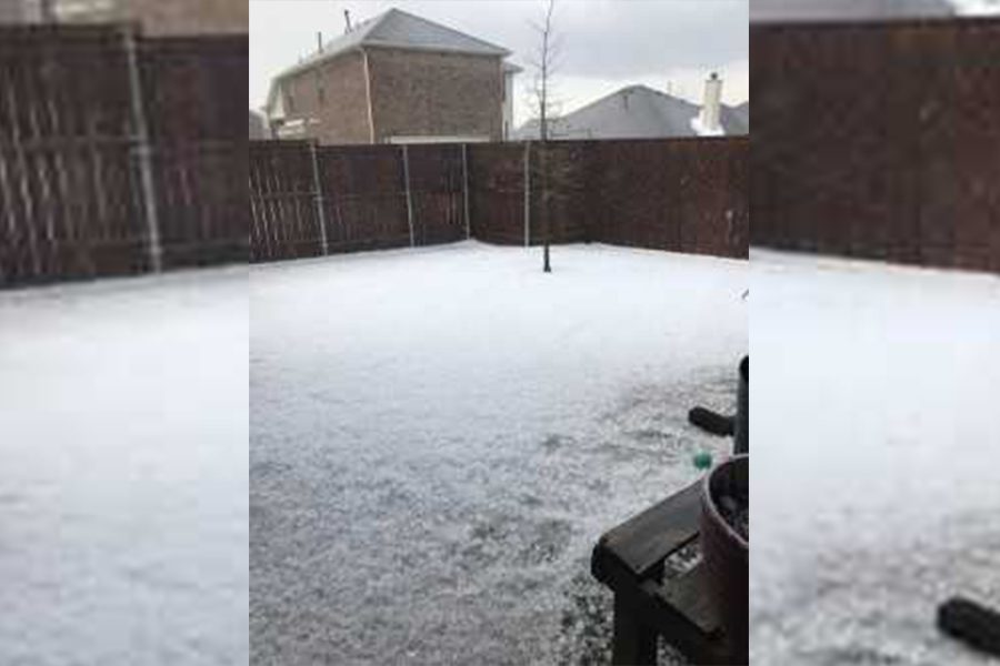 Looking more like snow than hail, the backyard of head volleyball coach Ui Womble is covered with thousands of pieces of hail after a storm on March 25, 2019.


