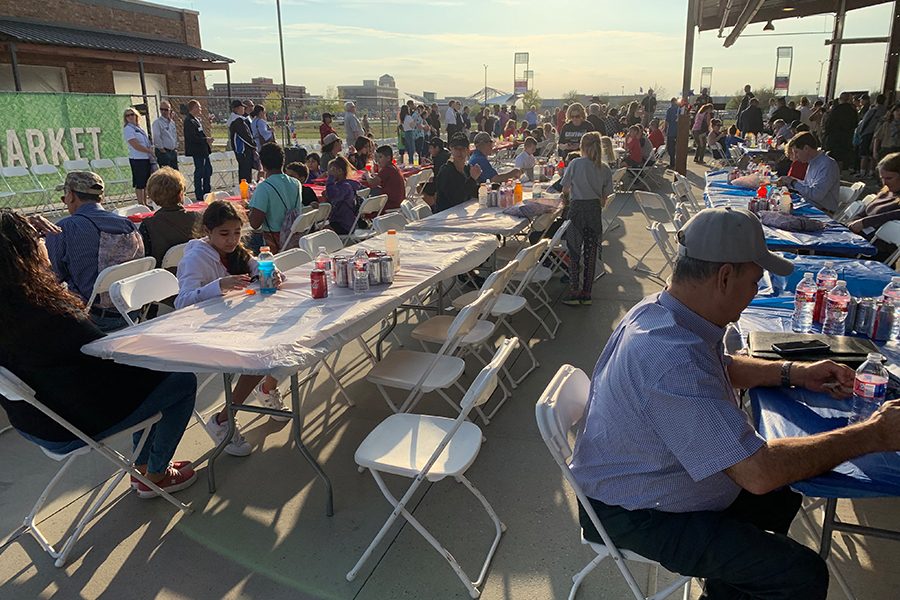 As the evening continues, increased number of people attend the Frisco Fair with family and friends. The long decorated tables are filled with people eating fair food or enjoying the band’s live music. 
