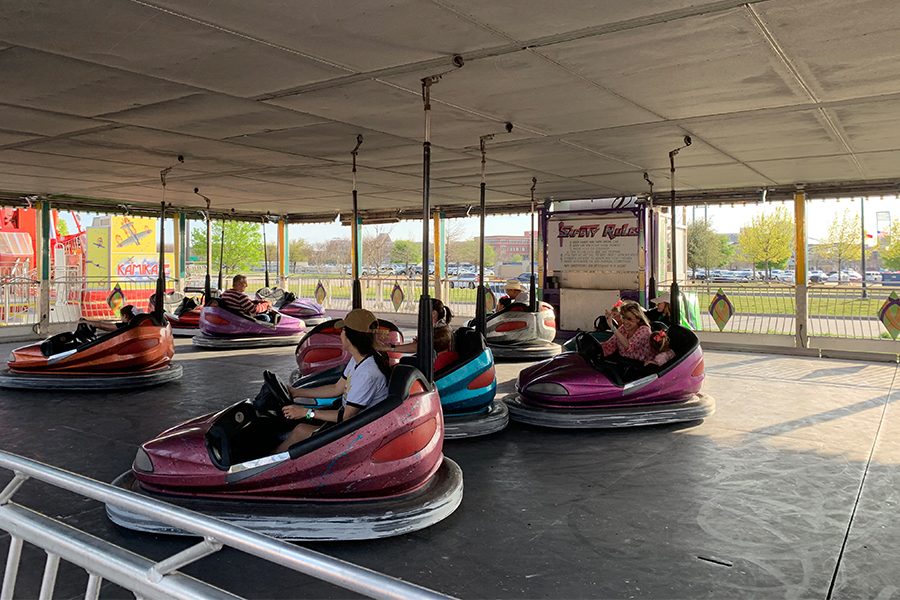 Frisco Fair attendees bump into one another as they ride the fair’s bumper cars. Admission to the fair is free, but rides require tickets with prices varying depending on the ride. 