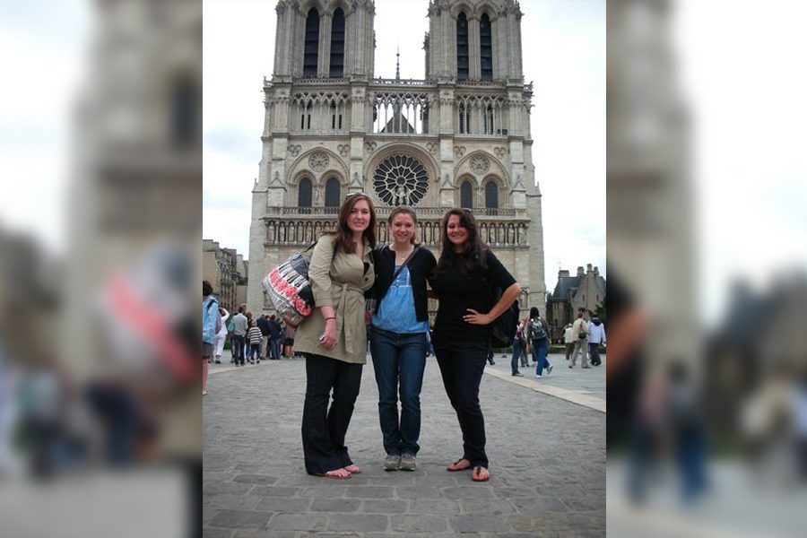 Traveling to Paris on three separate occasions, AP European History teacher Kristen Mayfield (left), stands in front of Notre Dame during a study abroad trip in 2009. On each trip to Frances capital, Mayfield has visited Notre Dame, with her most recent time coming in the summer of 2018. 

