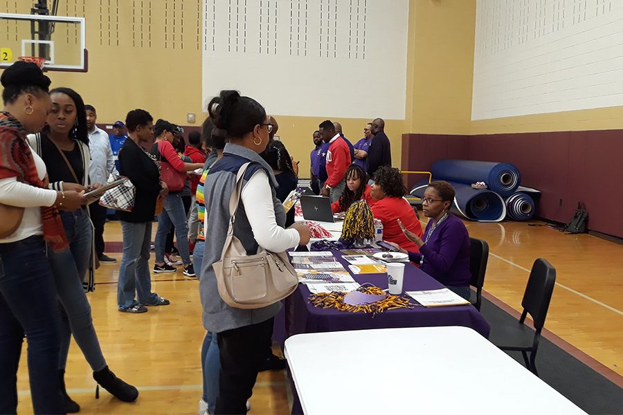 A parent talks to a college representative to learn about the best options for college in the previous college fair hosted at Memorial High School. Attendees will have opportunities to meet with representatives of different schools, and get some insight into their options for the future. 
