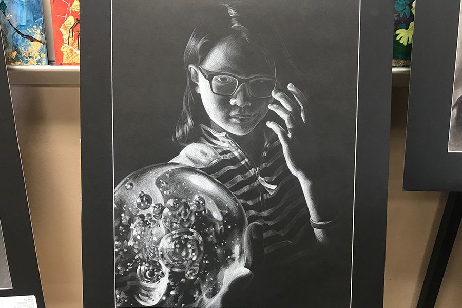 Earning a gold seal, junior Sunyoung Yu drew a self portrait to take to the state VASE competition on Friday and Saturday in San Marcus. This was one of the many honors the art department was able to bring home.