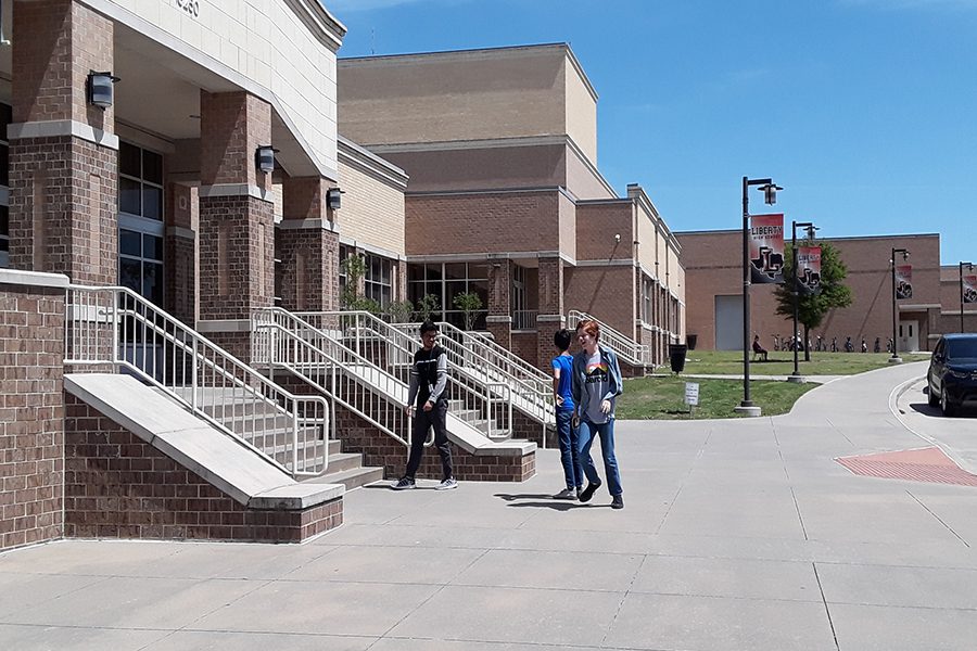 Students walk around the front of the school. The first Frisco ISD Family Wellness Festival is Saturday at Independence High School from 10:00 a.m. until 1:00 p.m.