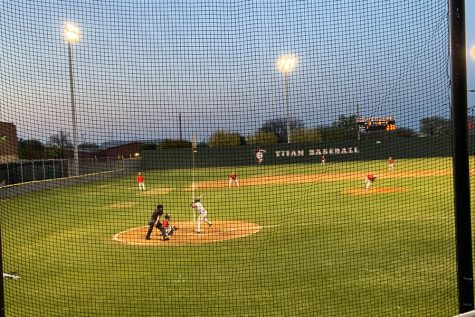 The Redhawks are batting against the Centennial Titans in a game last season. Baseball, along with other sports will no longer require a fee to participate.