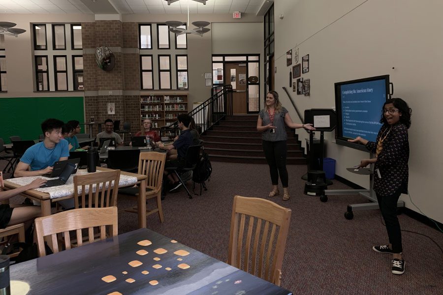 American Studies teachers Emily Griffin (L) and Swapna Gardner (R) instruct their students in the library last school year. Both the in-peron and virtual American Studies classes are now taking part in independent reading as a means to further develop their skills as readers. 