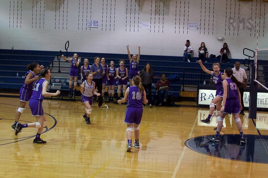 Jenna Wenaas and her middle school team at Vandeventer scores the final point, winning the game.  