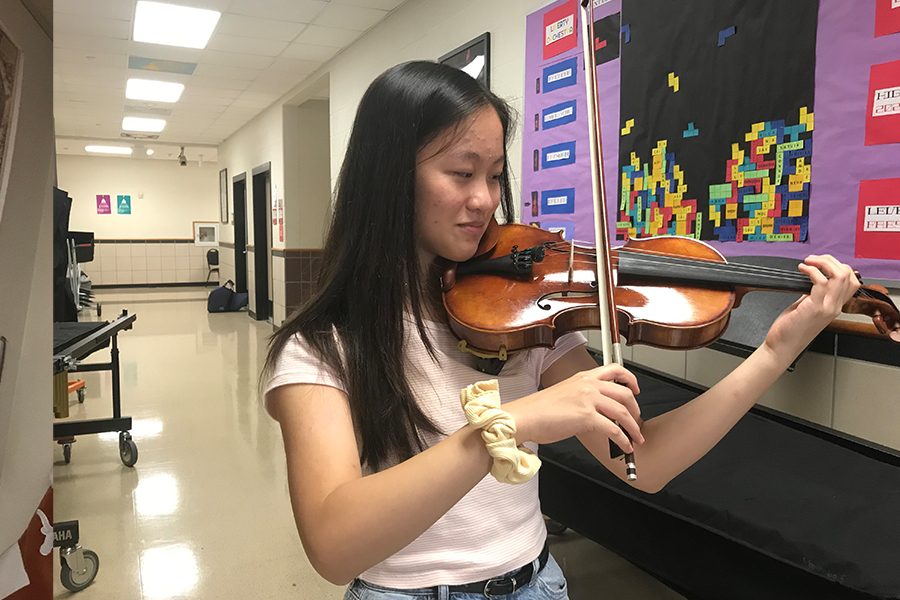 Violinist Sophie Lin has been playing for 6 years, and is excited to perform with the orchestra here on campus. 