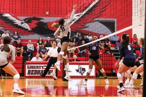 Senior Lauryn Hill puts up a block in hopes of running a successful defense. Hills enters Fridays game against Independence just three kills short of 1000 in her career. 