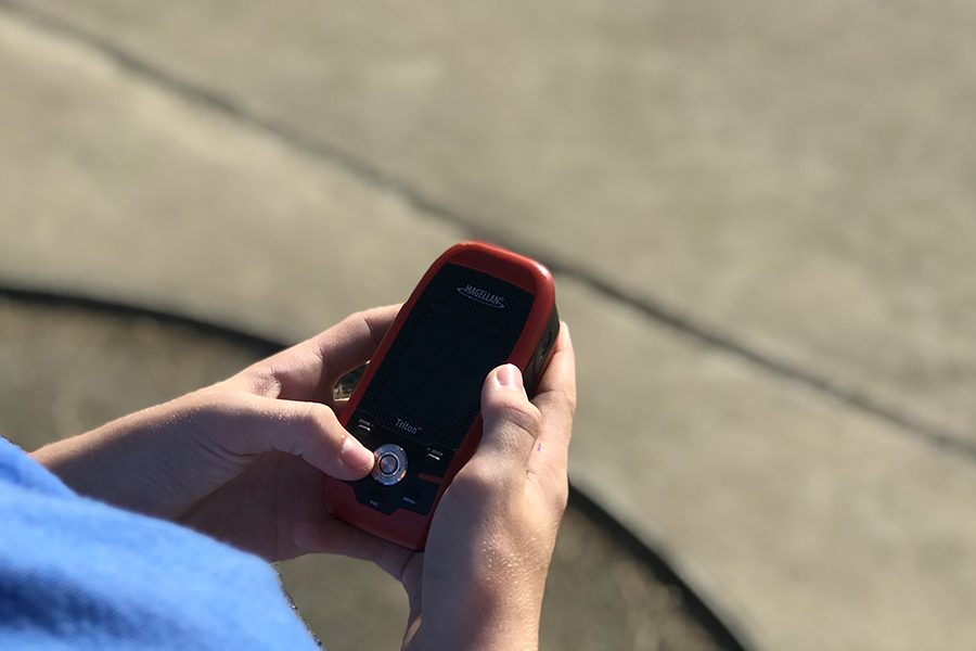 Putting their GPS knowledge to the test, students in outdoor education are hiding geocaches around the community as they learn about GPS usage. 
Similar to treasure hunting, geocaching is an outdoor activity where participants use a GPS to to find hidden objects. 