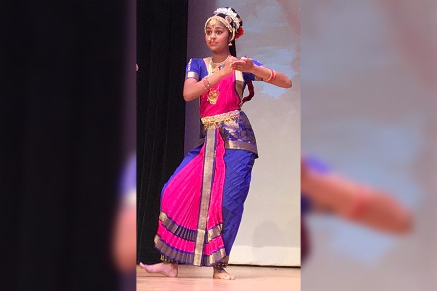 Freshman Ananya Gardas portrays a musician playing the Nattuvangam, an instrument used to maintain the beat of the dance.