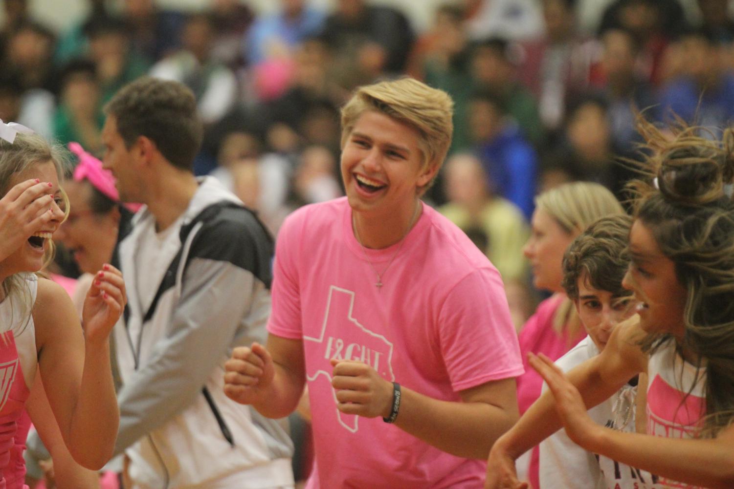 Pink temporarily replaces red and black at pep rally