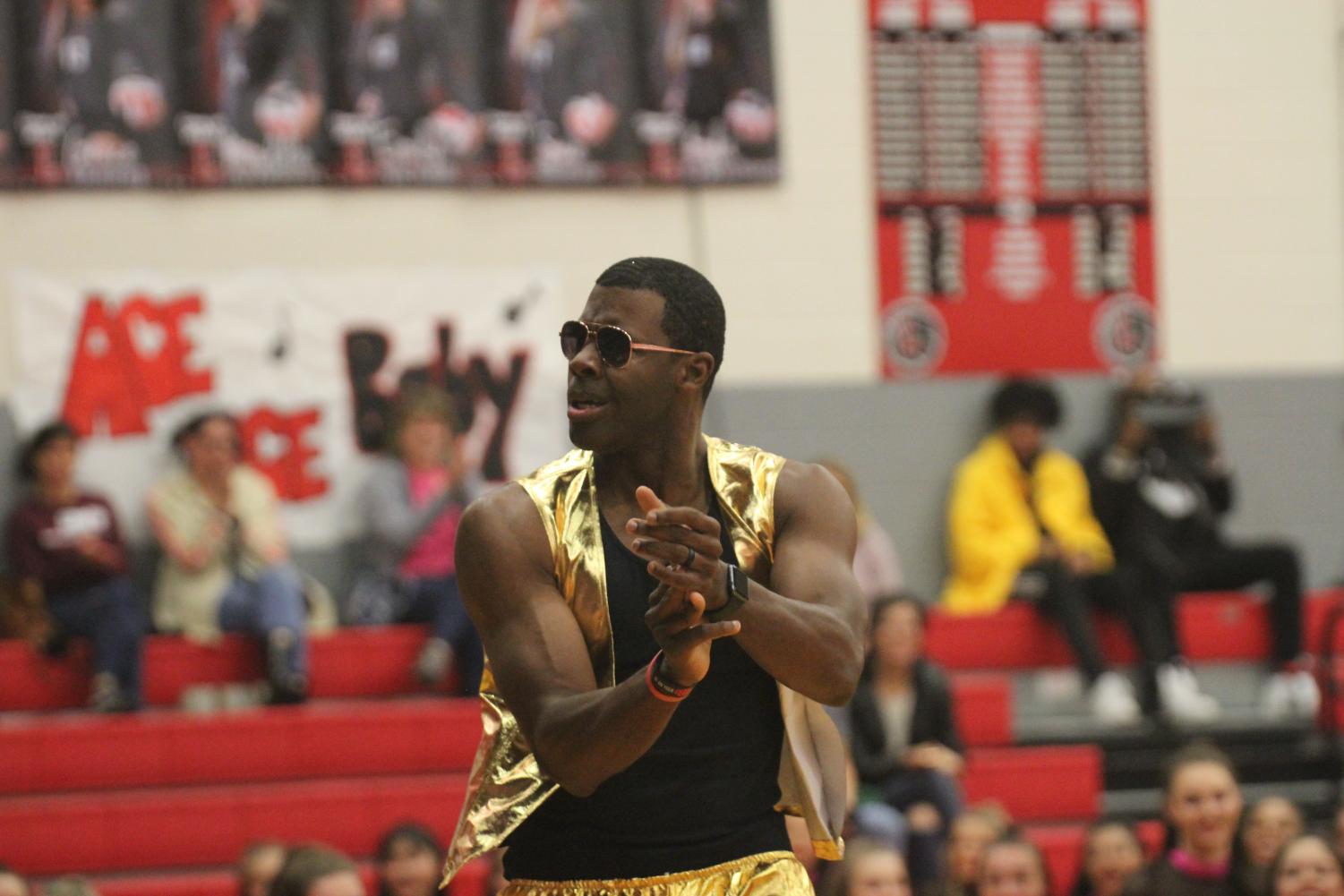 Pink temporarily replaces red and black at pep rally