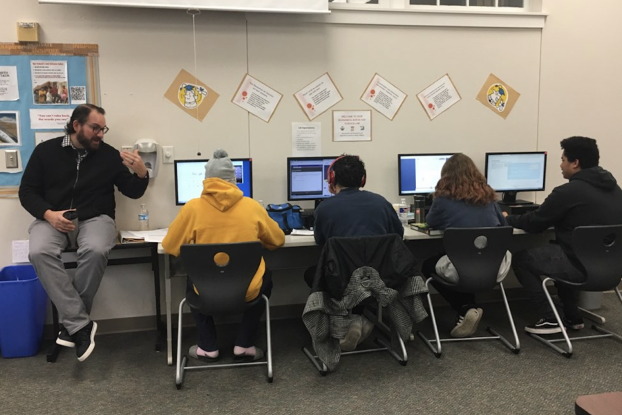 Math teacher Mark Matthews instructs students while they are working on coursework at the Academic Academy. The SOC has typically about 150 students enrolled in the program at any time.