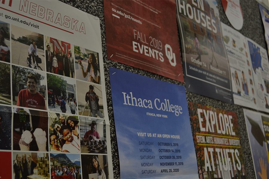 College representatives from a variety of schools have set up booths in the cafeteria. The different representatives highlight the different paths students may take if they pursue post-secondary education.