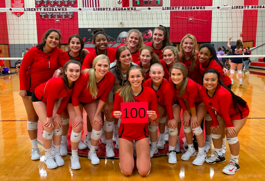 Wenaas hold up a sign from her teammates, to commemorate her 100th win with Redhawk volleyball. Wenaas was the first Redhawk to reach 100 victories for volleyball, and was able to get this many as a four year varsity player. 