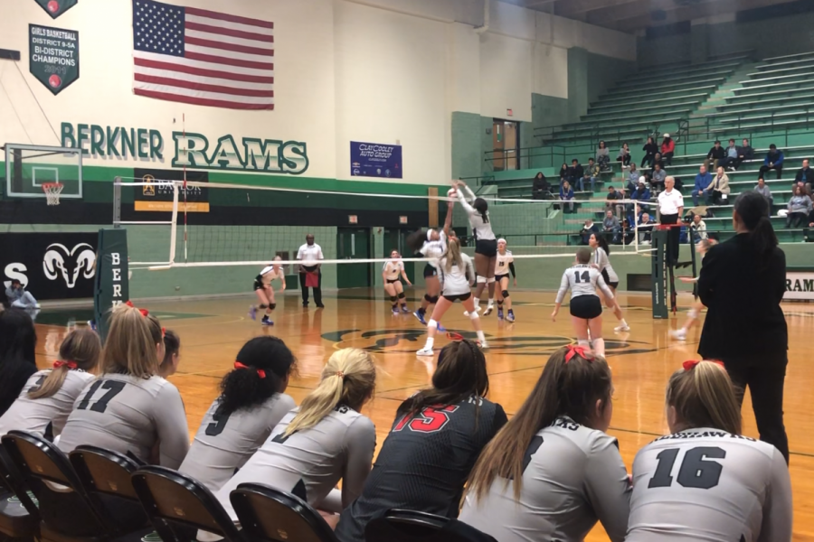 In their second round of playoffs against RL Turner, sophomore Paeton Davis blocks the ball from even crossing the net. The team came out with a win, and will advance to the next round of district. 