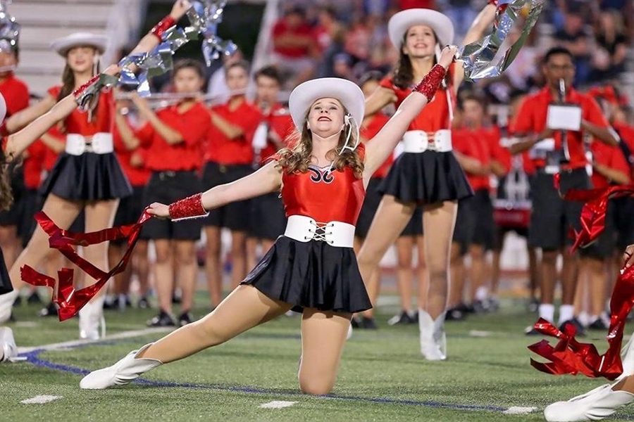 During their fall performance season, senior Emma Hancock dances during half time for Red Rhythm alongside her fellow dancers. Each spring, Red Rhythm, Cheer, and Colorgaurd typically host tryouts, but with current health concerns, these will be pushed to a later date. 