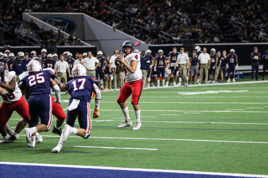 Junior Will Glatch sets up a pass to attempt scoring a touchdown against Wakeland.