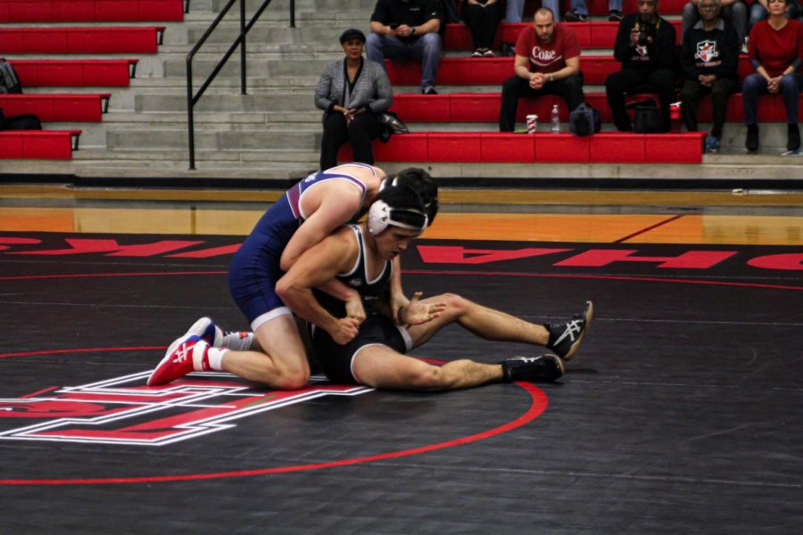 In their duel against Northwest High School, senior Connor Leech worked a sit out to try to escape from his opponent. In their duel Thursday, the team looks to take down Lebanon Trail and Memorial, and add another win to their undefeated district season. 