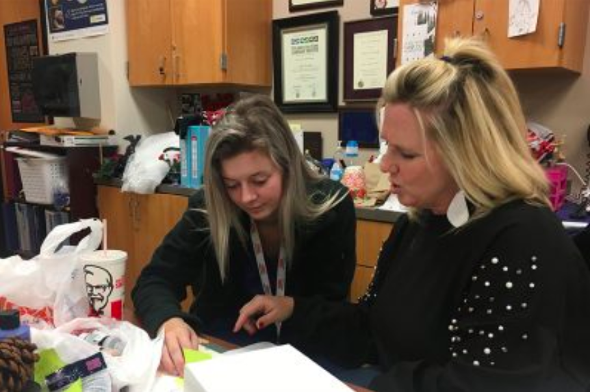 In 2018, senior Caitlyn Schroeder and Student Council sponsor Kandy Stevens set up for Teachers Night Out, where Student Council watches teachers kids to give them a well deserved night off. This year, the same event will be held Friday in the gym from 5:00-9:00 p.m.