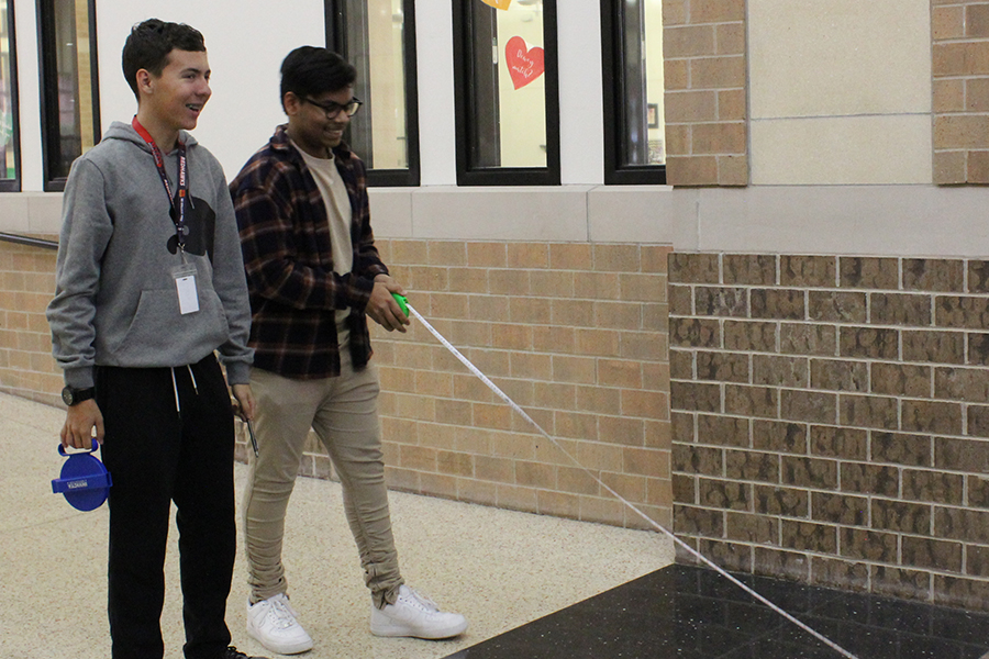 Sophomore Nathan Chandran and Leo Larsen collaborate on a hands-on geometry project. 