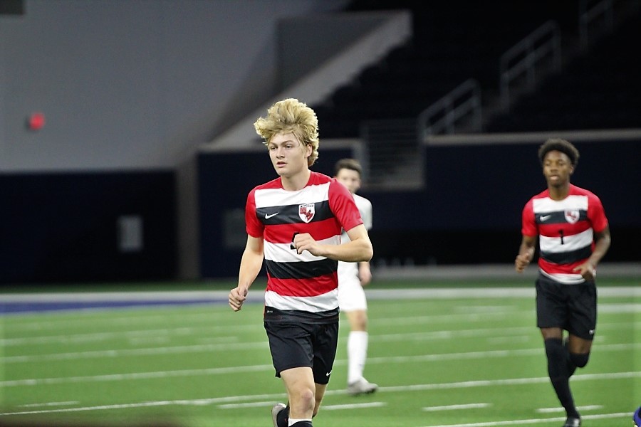 Tracking the ball down the sideline, sophomore Jack Bryan positions himself on defense.
Taking on Lebanon Trail on Friday in District 9-5A play, the Redhawks and Trail Blazers finished the game at 0-0. 

Earning a point from the draw, the Redhawks are in 9th place in the district standings. 
