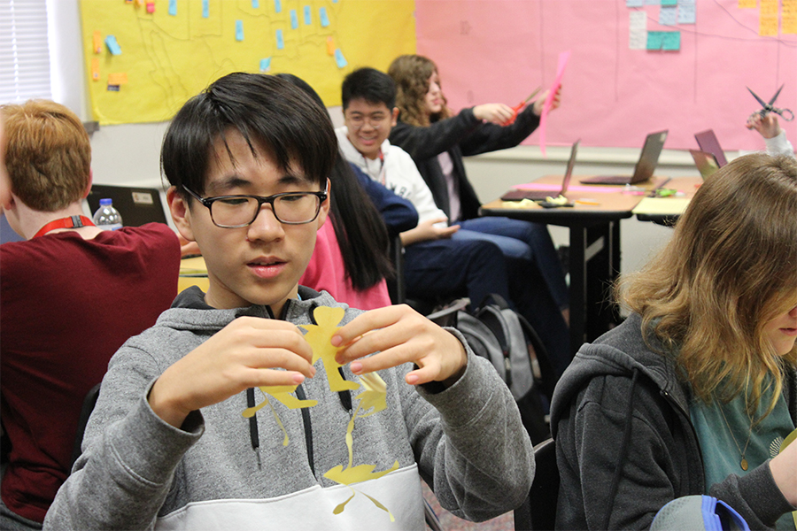 Freshman William Zhang and the rest of the students in the AP Human Geography class spent Wednesday and Thursday creating paper doll chains.

The arts and craft project saw students cut out the dolls and then write facts about women in agriculture on them. 