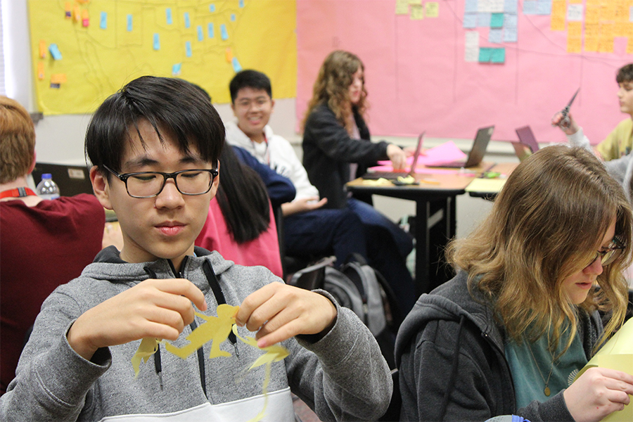 Freshman William Zhang admires his Women in Agriculture cutout in HGAP on January 23rd. 