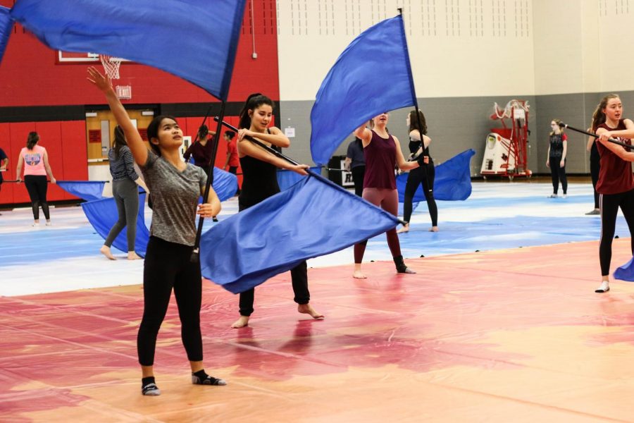 Preparing for winter guard in the practice gym on campus, color guard has officially transitioned to winter guard. Straying away from football games, winter guard will focus on more stage performances.