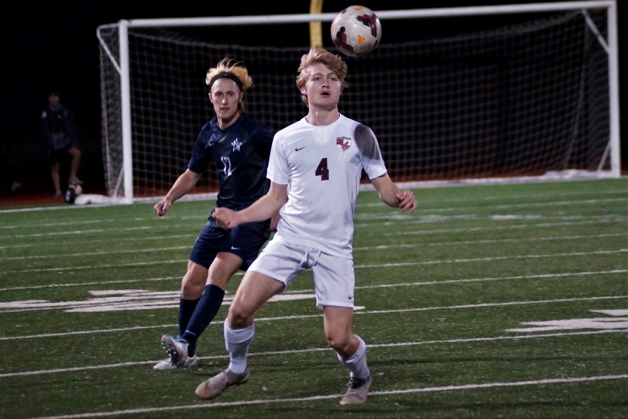Sophomore Jack Bryan bounces the ball on his chest. 
