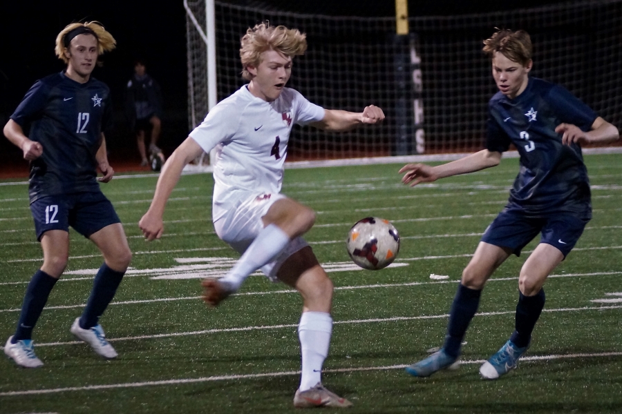Kicking ball to his teammates, sophomore Jack Brian played against Lone Star High School on Feb. 7, 2020. 