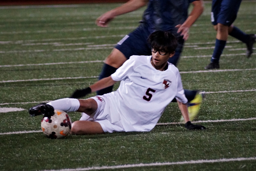 Andrew Siv, sophomore, traps the ball in between his feet. 