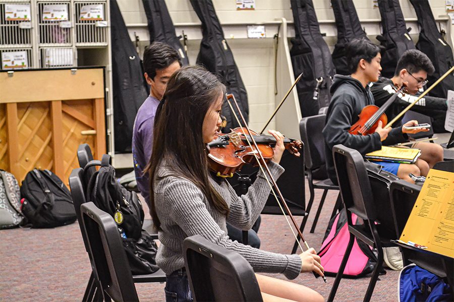 Practicing GDYO excerpts during advisory, sophomore GDYO violinist prepares for the annual audition in the program that determines orchestra placement.