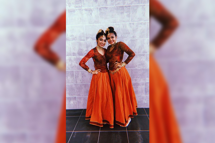 Smiling for a picture, Kosuri poses dressed in a traditional dance dress with a fellow performer. For Kosuri, Indian dance has helped her not only connect to her roots, but explore and express her culture. 