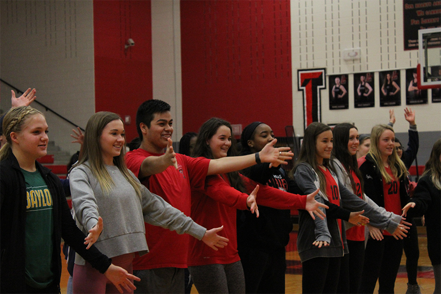 Redhawks smile as they participate in Just Dance in the gym during advisory on Friday, Jan. 31, 2020.