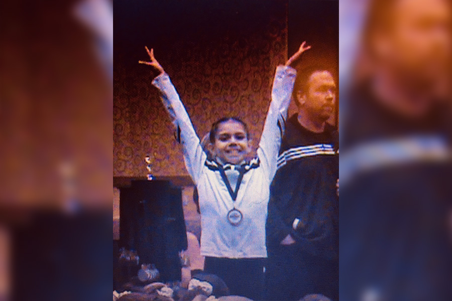 At six years old, Karina took first in state for her gymnastics floor routine, earning her one of the first gold medals in a career that would bring many more to come. Being that both wrestling and gymnastics require immense dedication and focus, her expirence in the gym translated well to new skills on the mat. 