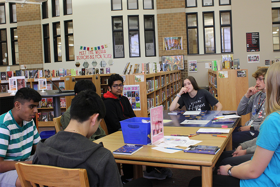 As a way to help them understand the book, PAP English 2 students took to the library for their discussion.