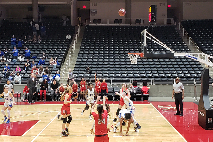With scoring at a premium in the 5A Region II final versus Midlothian, junior Maya Jain (#24) holds her hands in the air after shooting (and making) a three point shot in overtime. The Panthers led the Redhawks 4-2 at the end of the first quarter with both teams trading leads throughout the triple overtime game won by the Redhawks 48-43. 